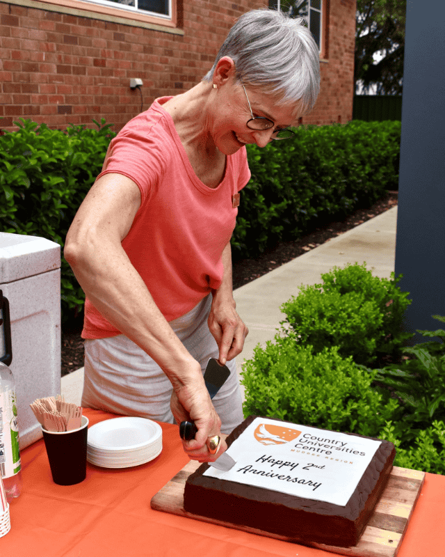 Cutting the second birthday cake at CUC Mudgee Region's AGM in 2026.
