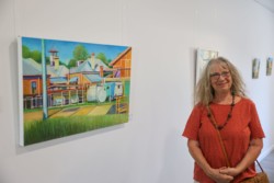Artist Janet Marcus with one of the first pieces hung in the new Centre.