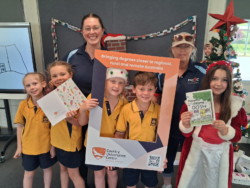 Out Of School Hours Care students with their cookbook supported by CUC Mudgee Region.